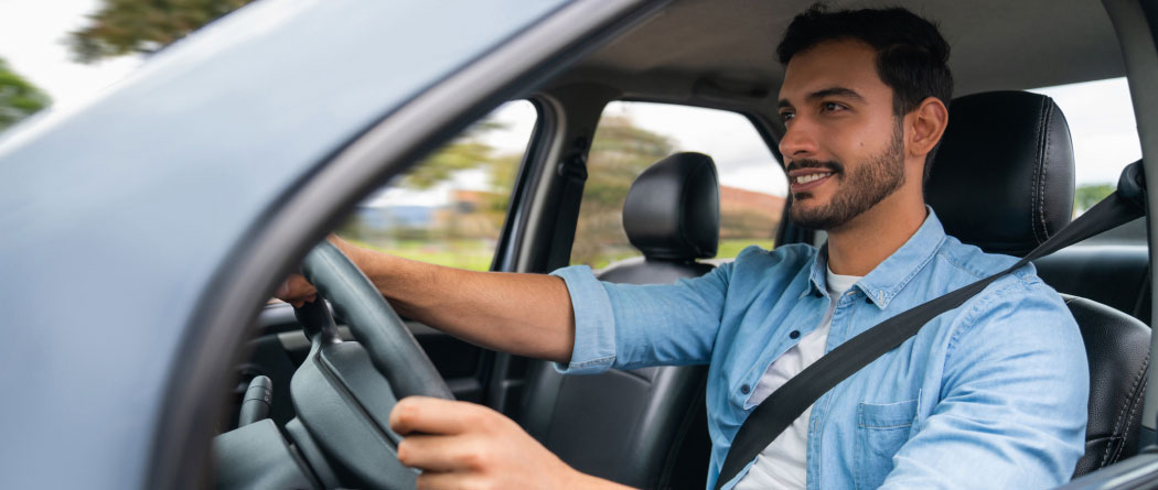man driving a car