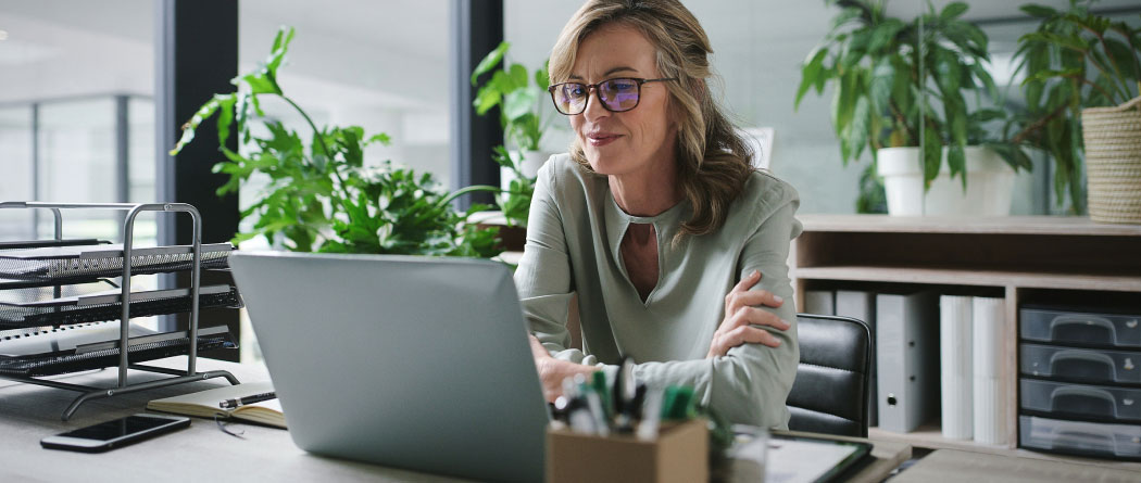 woman using a laptop in an office