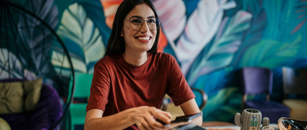 young woman paying with a smartphone